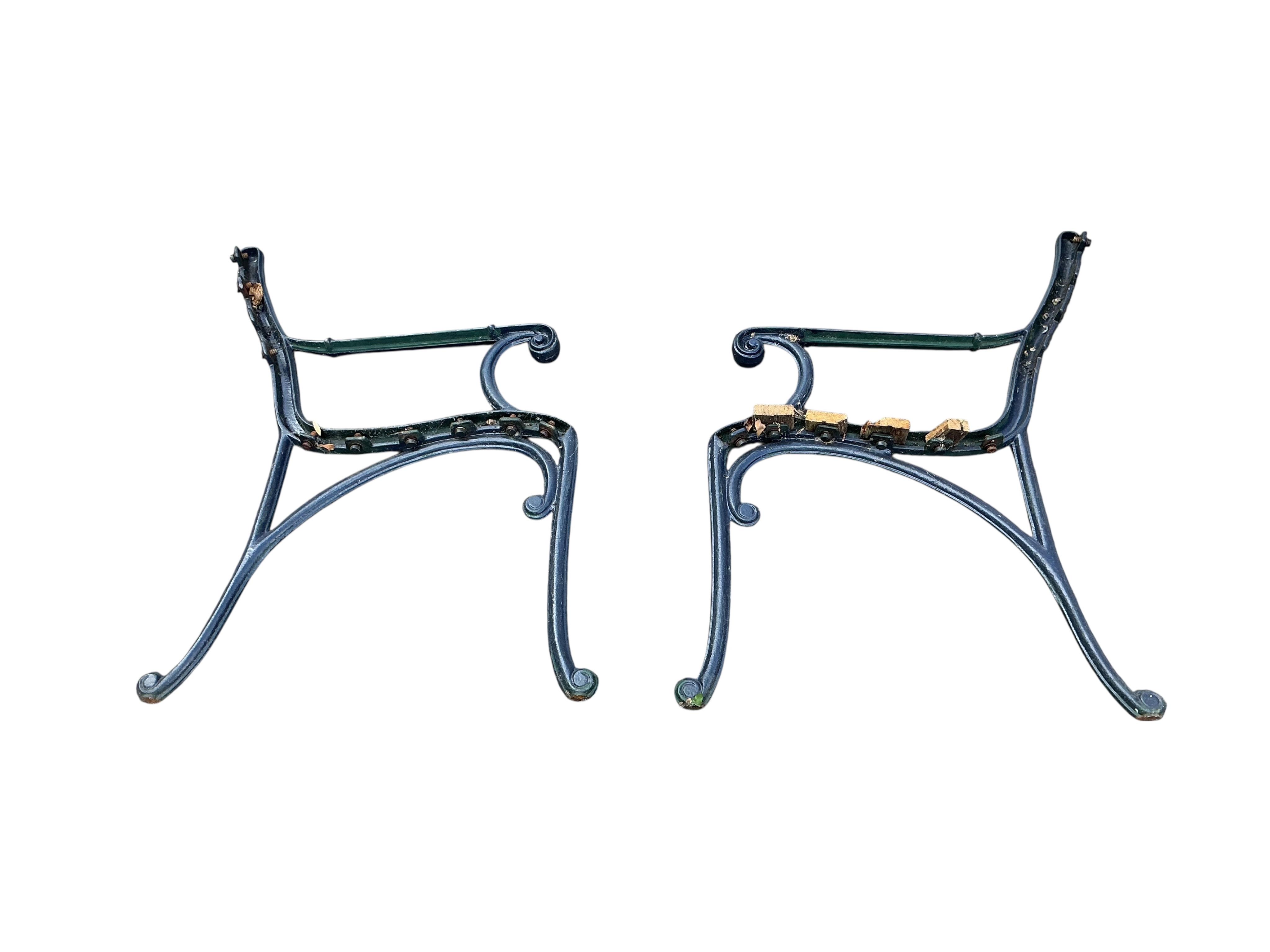 A cast metal slatted garden bench, width 115cm, together with three matching garden armchairs and four bench ends